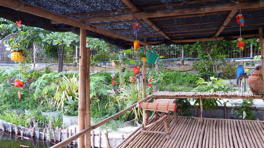 The bamboo hut over the canal next to the kitchen