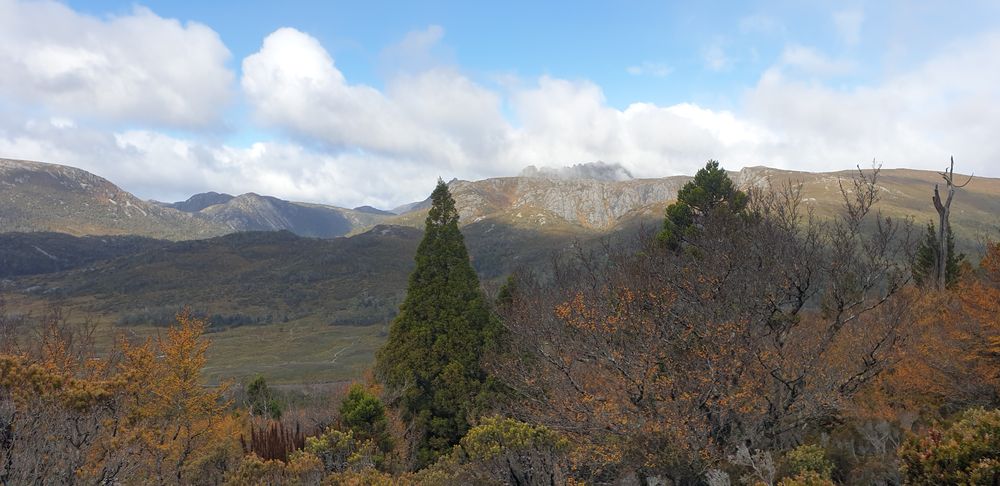 Cradle Mountain is partially revealed from cloud cover