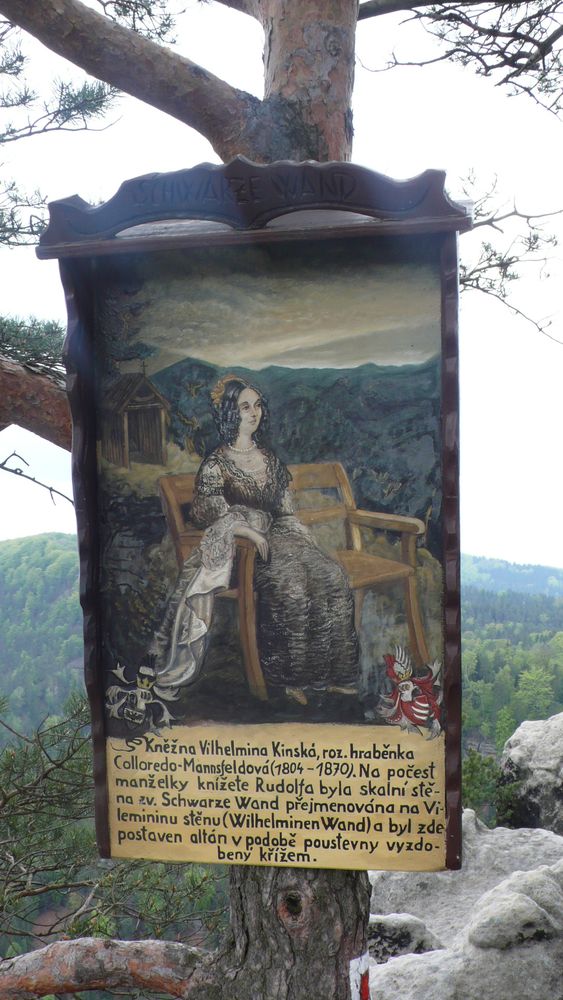 These painted information boards were common on the walk. This one I think explains something about the woman in the painting Countess Vilhelmina, who married into the House of Kinsky. In honour of her husband, the rock wall in the Schwarze Wand (I think the name of the rock feature) and a gazebo were built and a cross erected.