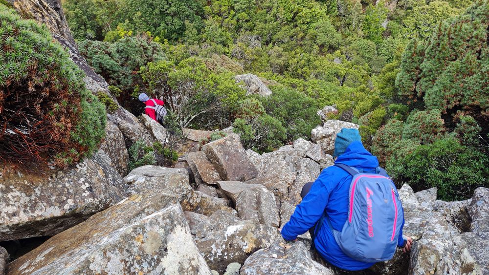 Heading down the short steep boulder section